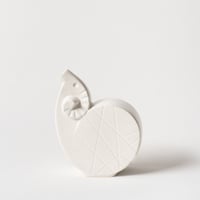 curled sheep vase