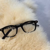 black-rimmed glasses