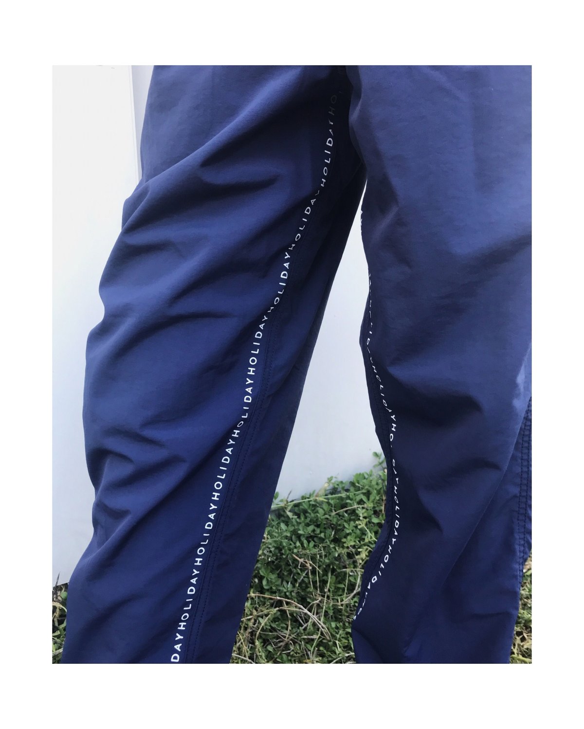 HOLIDAY トラックパンツ HOLIDAY「 LINE HOLIDAY TRACK PANTS」 | gouter le