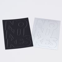 “NO NUKES” stickers