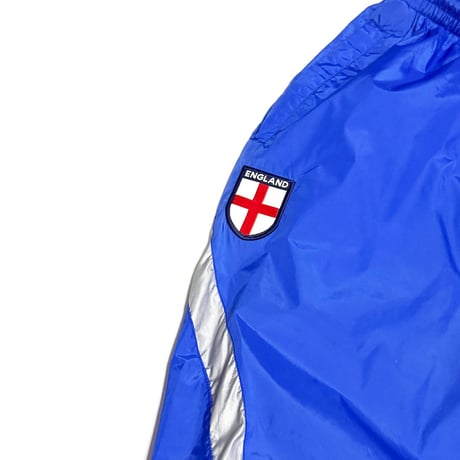 【USED】00's UMBRO England Nylon Track Pants Blue × Silver Panel
