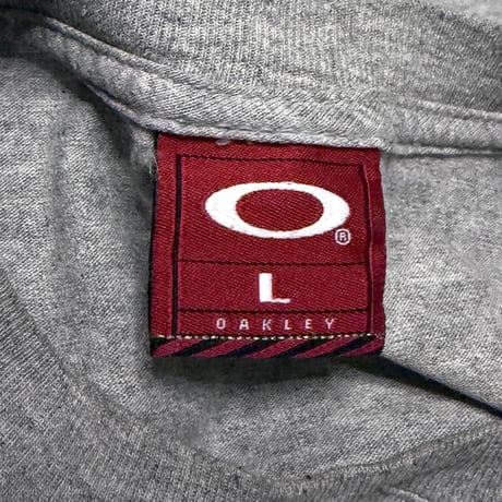【USED】00's OAKLEY "WORLDWIDE" Ellipse Globe Graphic L/S T-Shirt