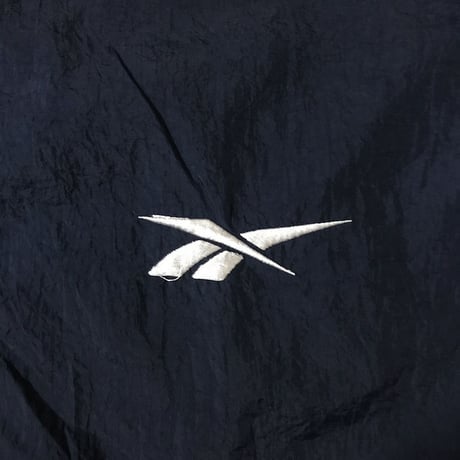【USED】90'S REEBOK NYLON JACKET EMBROIDERY ON THE SLEEVE
