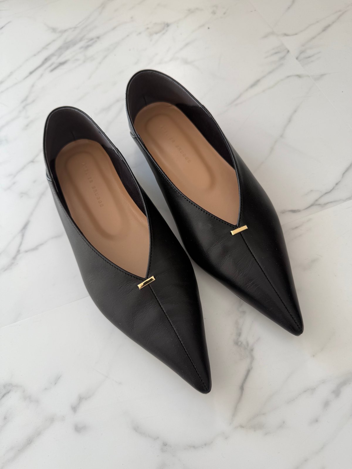 metal motif flat shoes | Un sourire.