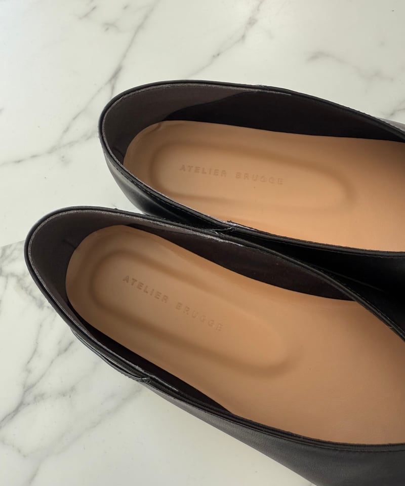 metal motif flat shoes | Un sourire.