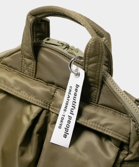 【beautiful people（ビューティフルピープル）】POTRxbp helmet bag in nylon twill–ecru