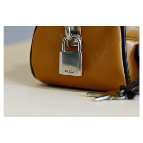 Vintage “PRADA” Leather Handbag With Clochette