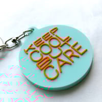 DONATION (寄付3,000円)→キーホルダー：KEEP COOL BUT CARE（ホリゾンブルー×オレンジ）