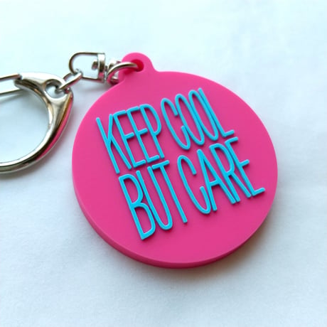 DONATION (寄付3,000円)→キーホルダー：KEEP COOL BUT CARE ver.2（マゼンタピンク×シアンブルー）