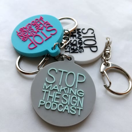 DONATION (寄付3,000円)→キーホルダー：STOP MAKING THE SIGN PODCAST（グレー×ホリゾンブルー）