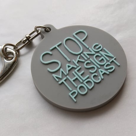 DONATION (寄付3,000円)→キーホルダー：STOP MAKING THE SIGN PODCAST（グレー×ホリゾンブルー）