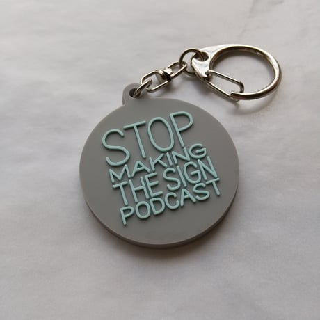 DONATION (寄付3,000円)→キーホルダー：STOP MAKING THE SIGN PODCAST（グレー×ホリゾンブルー）