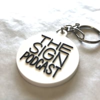 DONATION (寄付3,000円)→キーホルダー：THE SIGN PODCAST（ホワイト×ブラック）