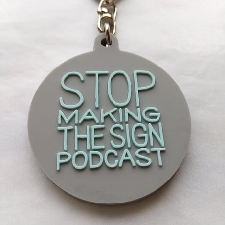 DONATION (寄付3,000円)→キーホルダー：STOP MAKING THE SIGN PODCAST（グレー×ホリゾンブルー）