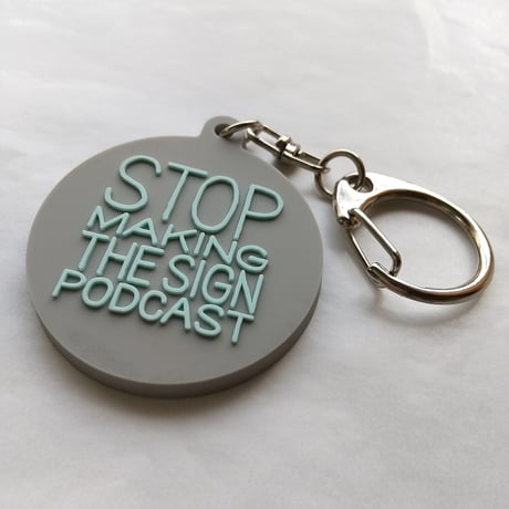 DONATION (寄付3,000円)→キーホルダー：STOP MAKING THE SIGN PODCAST（グレー×ホリゾンブルー）