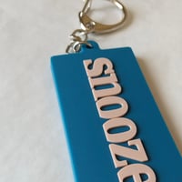 DONATION (寄付3,000円)→キーホルダー：SNOOZER（シェルピンク×マリンブルー）
