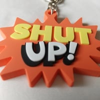DONATION（寄付3,000円）→キーホルダー：SHUT UP!（オレンジ）