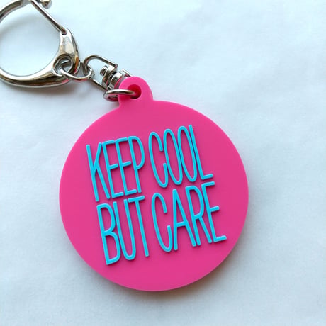 DONATION (寄付3,000円)→キーホルダー：KEEP COOL BUT CARE ver.2（マゼンタピンク×シアンブルー）
