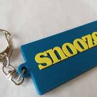 DONATION (寄付3,000円)→キーホルダー：SNOOZER（ジョンブリアンイエロー×マリンブルー）