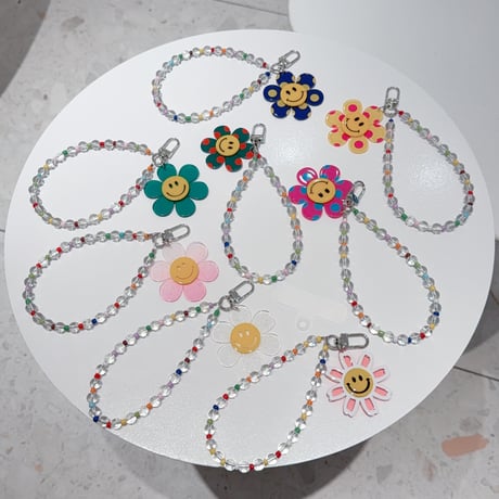 水玉模様 笑顔の花 スマホストラップ キラキラ感 お洒落 バックチャーム キーホルダー iPhone、Xperia、AQUOS、Xiaomi、Galaxy 対応 [M6296]