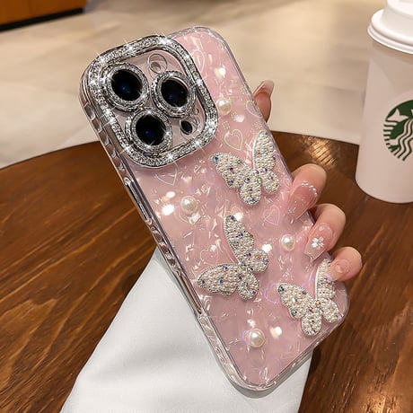 ジュエリー/パールデコ iPhone17/16promaxカバー 蝶々 カメラカバー iPhone15/14/13ケース 綺麗ストラップ キラキラハート入りシェル柄[M5590]