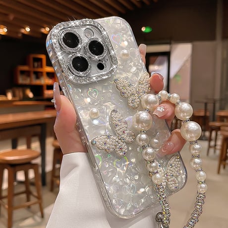 ジュエリー/パールデコ iPhone17/16promaxカバー 蝶々 カメラカバー iPhone15/14/13ケース 綺麗ストラップ キラキラハート入りシェル柄[M5590]