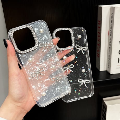 女子力高いリボン iPhone16/17proケース パールデコ iPhone15promax/14pro/13 シェル風/キラキララメ ジュエリーカメラ枠[M5643]