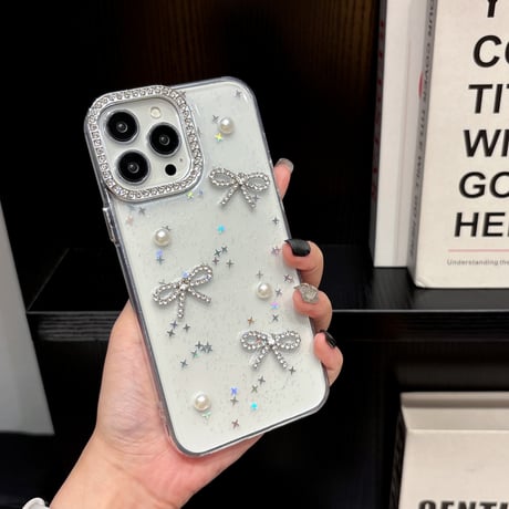 女子力高いリボン iPhone16/17proケース パールデコ iPhone15promax/14pro/13 シェル風/キラキララメ ジュエリーカメラ枠[M5643]