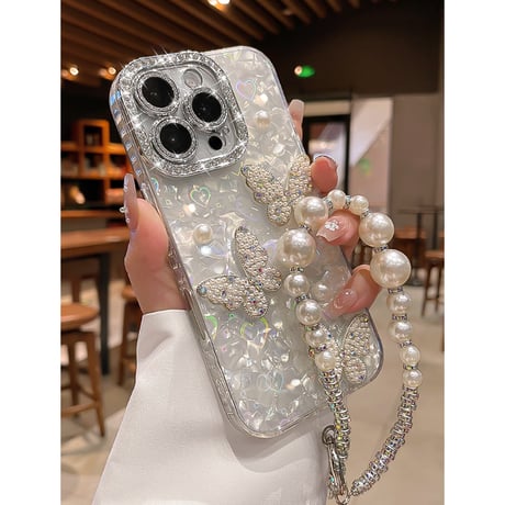 ジュエリー/パールデコ iPhone17/16promaxカバー 蝶々 カメラカバー iPhone15/14/13ケース 綺麗ストラップ キラキラハート入りシェル柄[M5590]