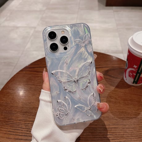 オシャレ iPhone15/15Proケース キラキラチョウ iPhone/14/13ケース ホワイト 女子に人気 [M3763]