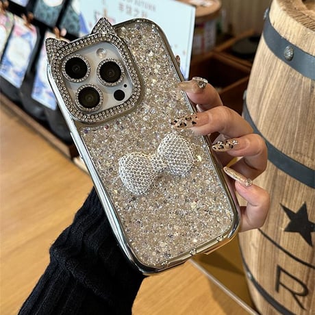 ジュエリーリボン iPhone16/16Proケース 猫耳 キラキラグリッター アイフォン15プロ/14/13proカバー おしゃれストラップ 豪華 [M4827]