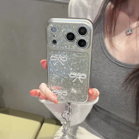 ジュエリーリボン iPhone17/17Proケース キラキラグリッター  iPhone16ProMax/15Pro/14カバー 毛玉ストラップ 大人可愛い [M5881]