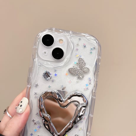 ハートミラー iPhone15/16proケース キラキラ蝶 アイフォン14/13pro/12ケース 女子力アップ うねうね[M4529]
