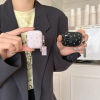Pink black flower ribbon strap airpodsケース
