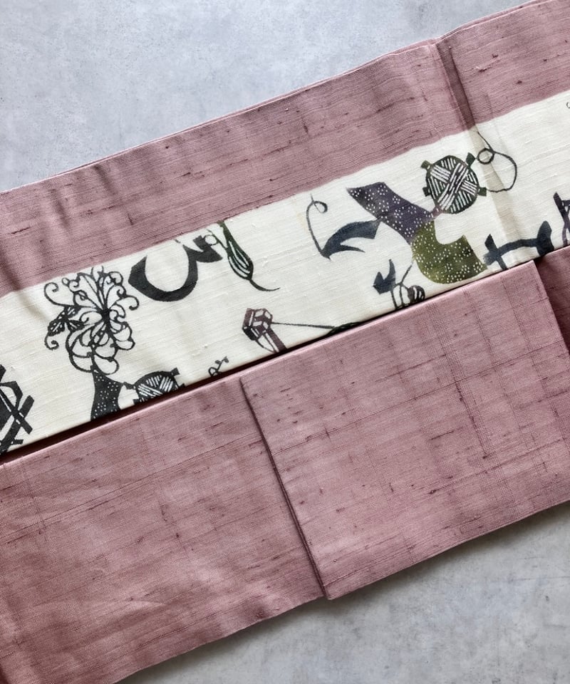 紬 名古屋帯 糸車文様 いろは文字 抽象柄 ピンク×生成り 正絹 