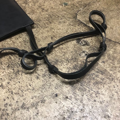TANGLED STRAP CLUTCH BAG