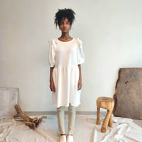 Shirred puff-sleeve dress.