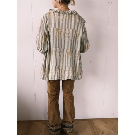 frill blouse with gold buttons