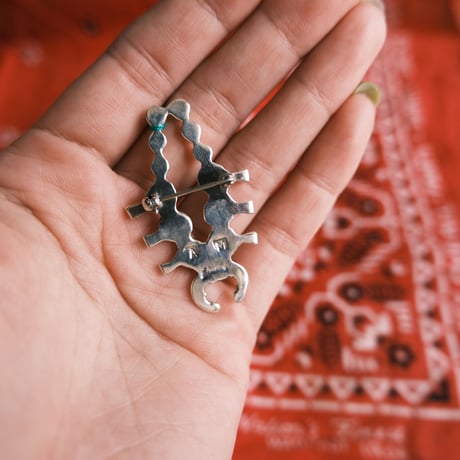 squash blossom brooch