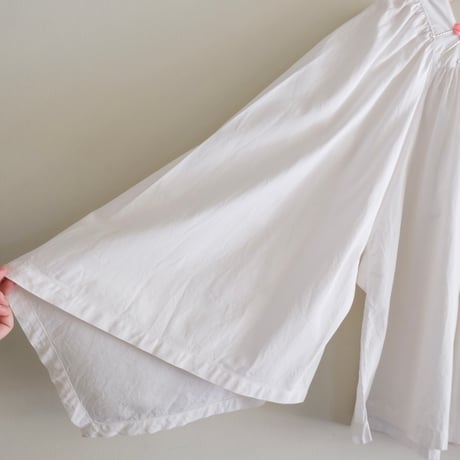 antique smock with smily hairpins