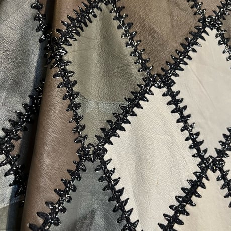 leather × crochet patchwork vest