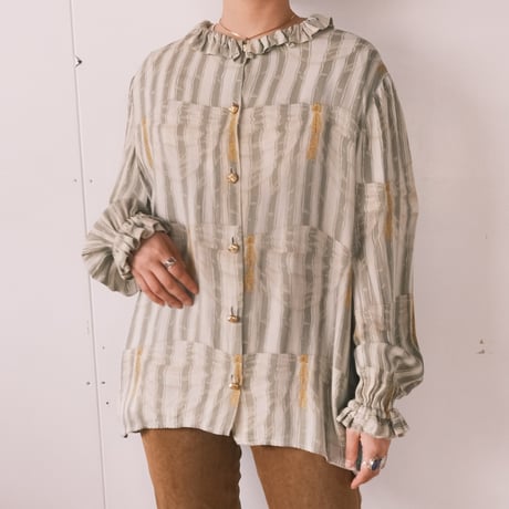 frill blouse with gold buttons