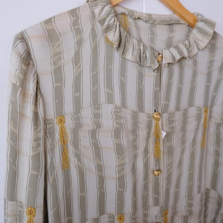 frill blouse with gold buttons