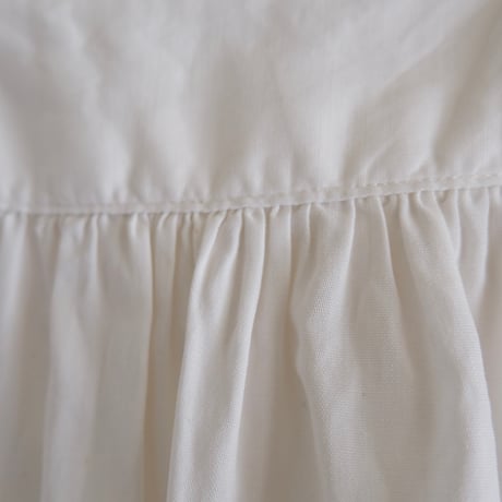 antique smock with smily hairpins