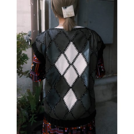 leather × crochet patchwork vest