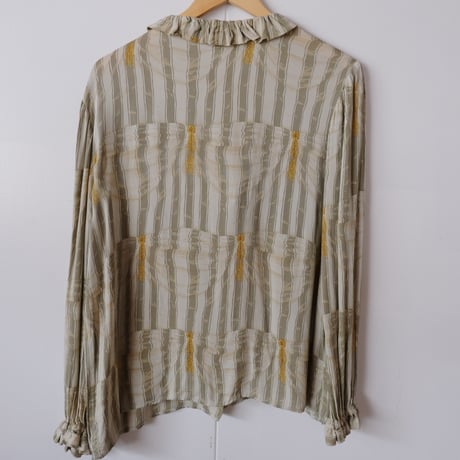 frill blouse with gold buttons