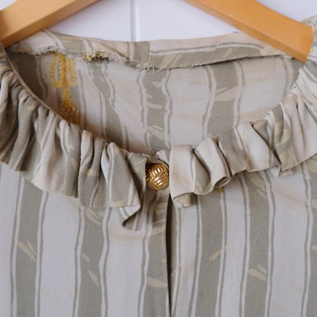 frill blouse with gold buttons