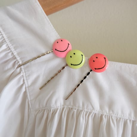 antique smock with smily hairpins