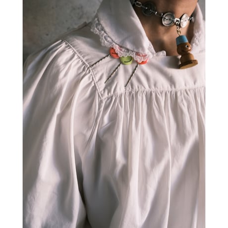 antique smock with smily hairpins