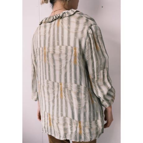 frill blouse with gold buttons